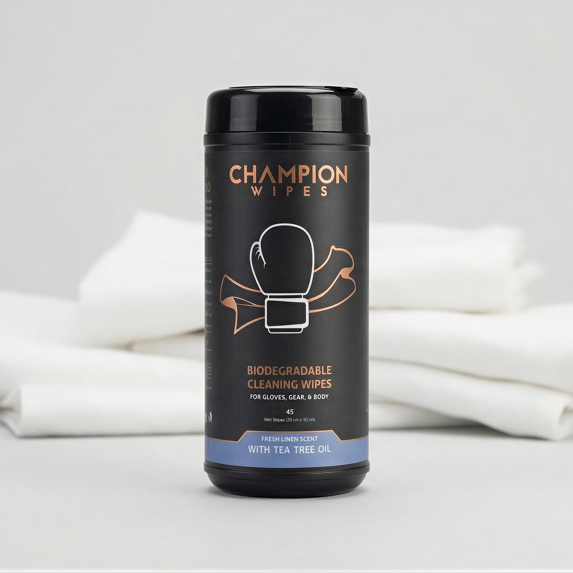 Container of Champion Wipes with white cloths on a gray background